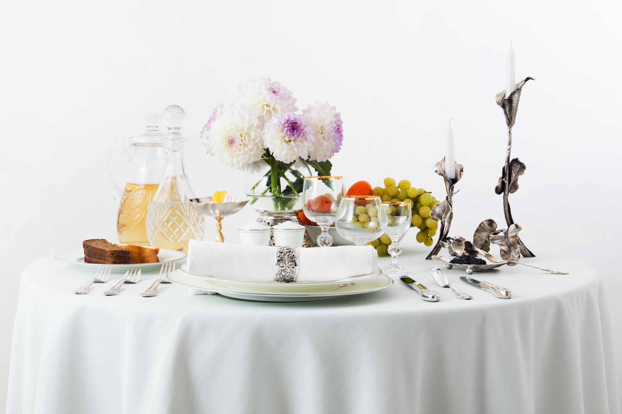 Table set for culinary tasting with candles